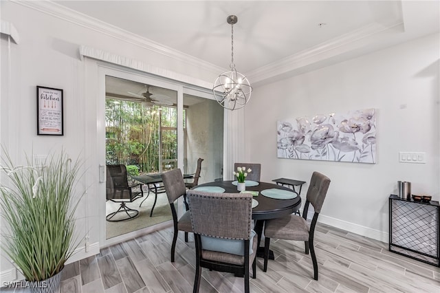 dining room featuring ornamental molding, ceiling fan with notable chandelier, and hardwood / wood-style floors