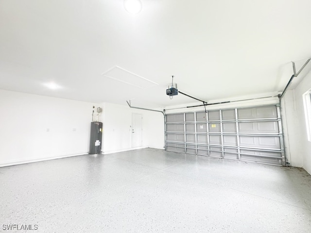 garage with a garage door opener and electric water heater