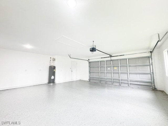 garage with a garage door opener and electric water heater