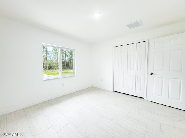 unfurnished bedroom featuring a closet