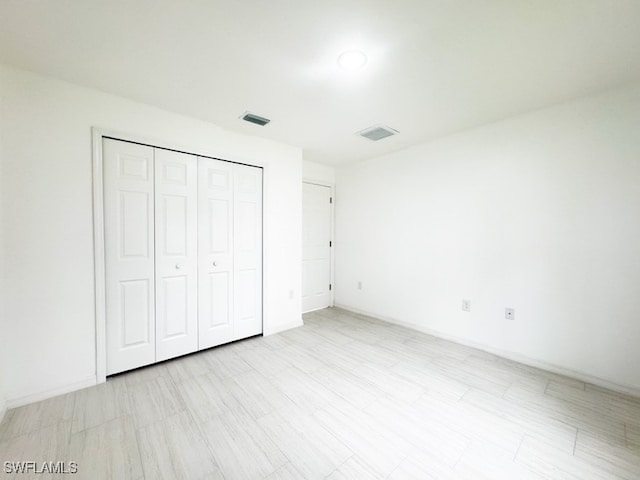 unfurnished bedroom with a closet