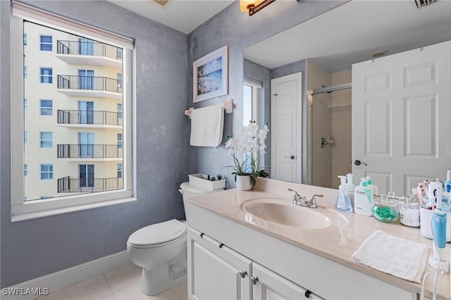 bathroom featuring vanity, toilet, tile patterned flooring, and an enclosed shower