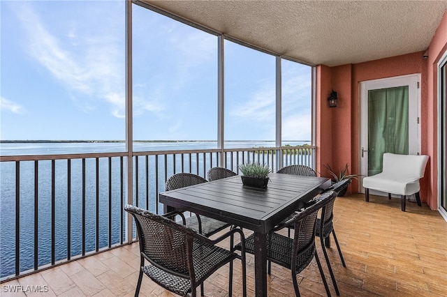 sunroom with a water view