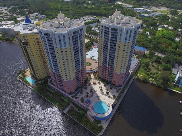 birds eye view of property with a water view