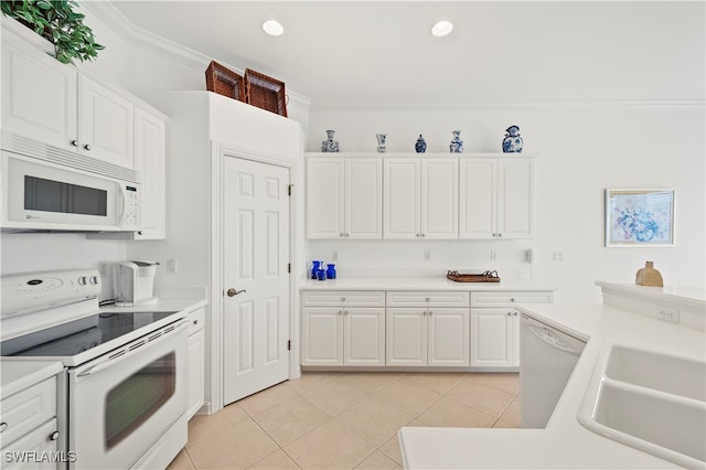 kitchen with ornamental molding, white appliances, sink, light tile patterned floors, and white cabinets