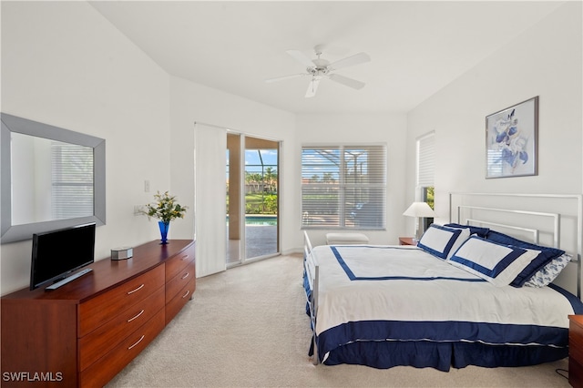 bedroom featuring access to exterior, light carpet, and ceiling fan