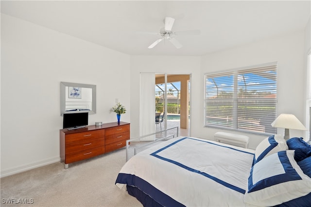 carpeted bedroom featuring access to outside and ceiling fan