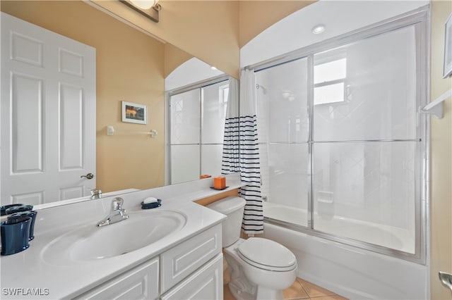 full bathroom with toilet, vanity, tile patterned floors, and bath / shower combo with glass door