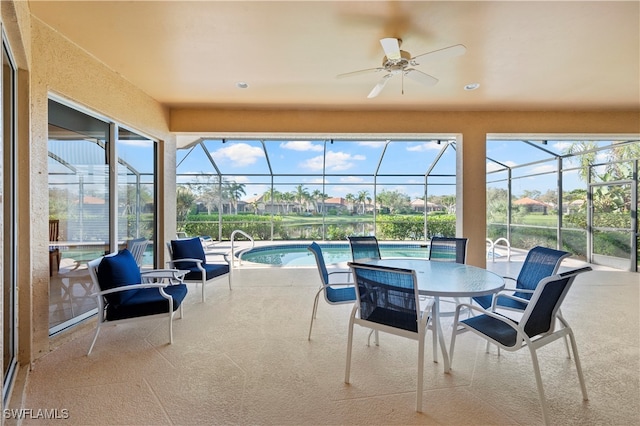 sunroom / solarium featuring a pool and ceiling fan