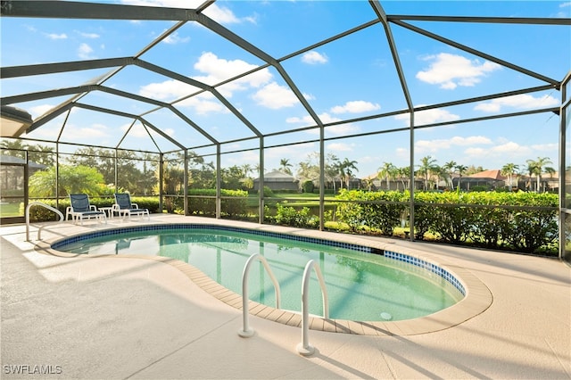 view of pool featuring a patio area and a lanai