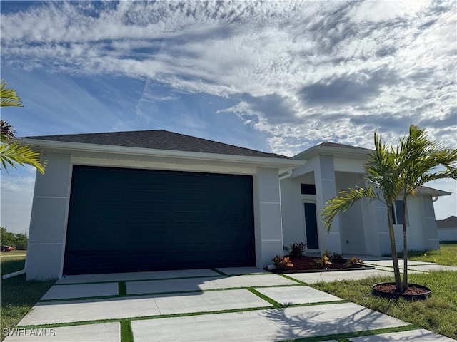 view of front of property with a garage