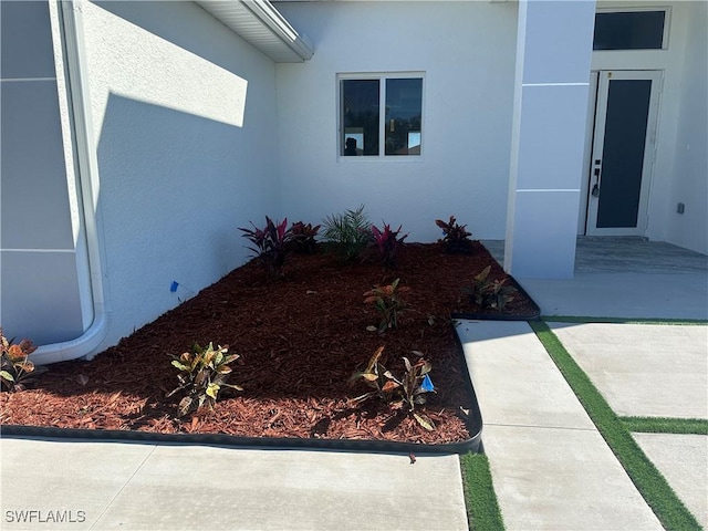 entrance to property with a patio