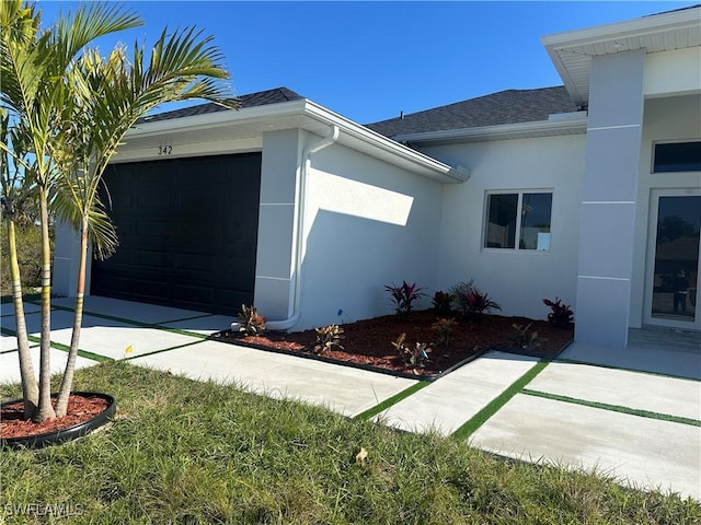 view of side of property featuring a garage