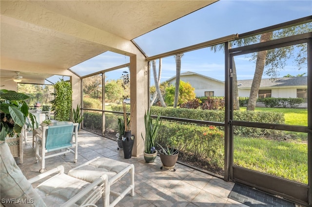 sunroom featuring ceiling fan