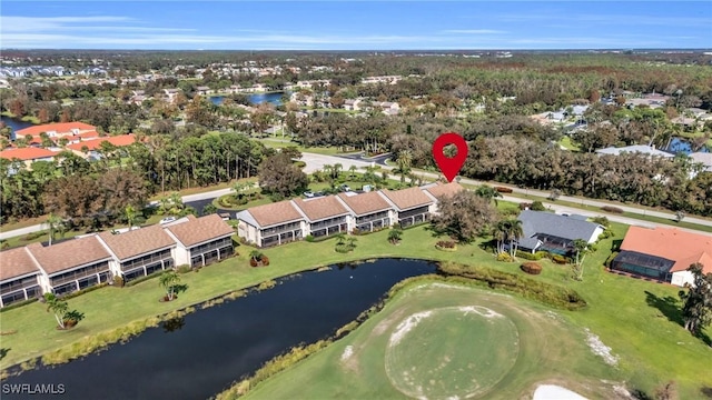 aerial view featuring a residential view, a water view, and view of golf course