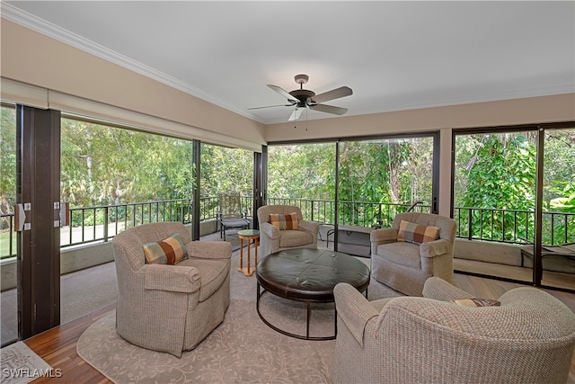 sunroom / solarium with ceiling fan and a wealth of natural light