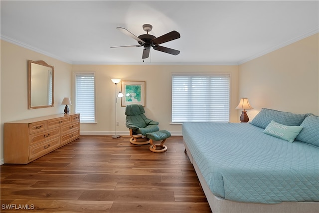 bedroom with multiple windows, ceiling fan, dark hardwood / wood-style floors, and crown molding