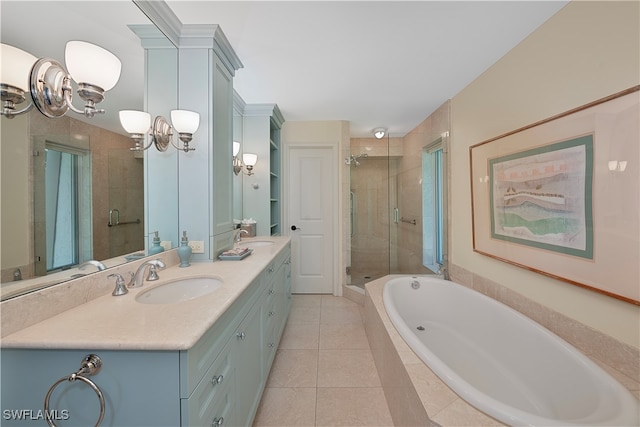 bathroom featuring vanity, tile patterned flooring, and separate shower and tub