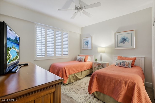 bedroom featuring hardwood / wood-style flooring and ceiling fan