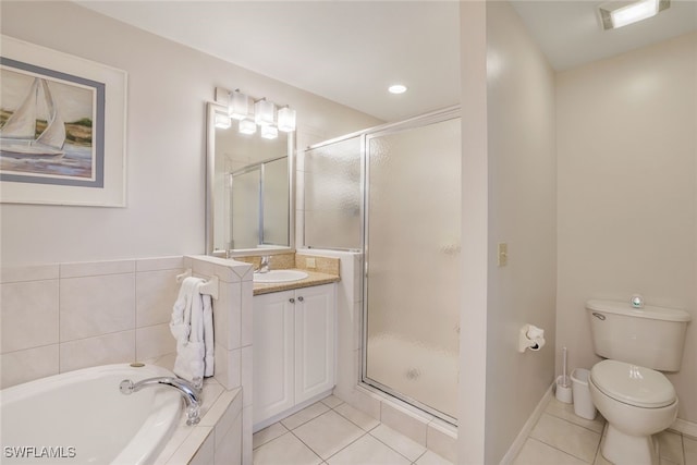 full bathroom with tile patterned flooring, toilet, separate shower and tub, and vanity