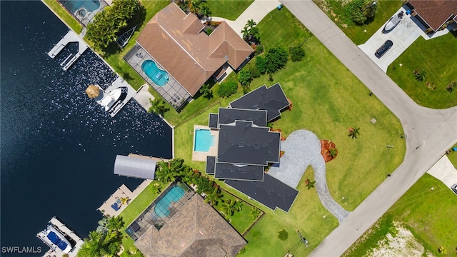 drone / aerial view with a water view