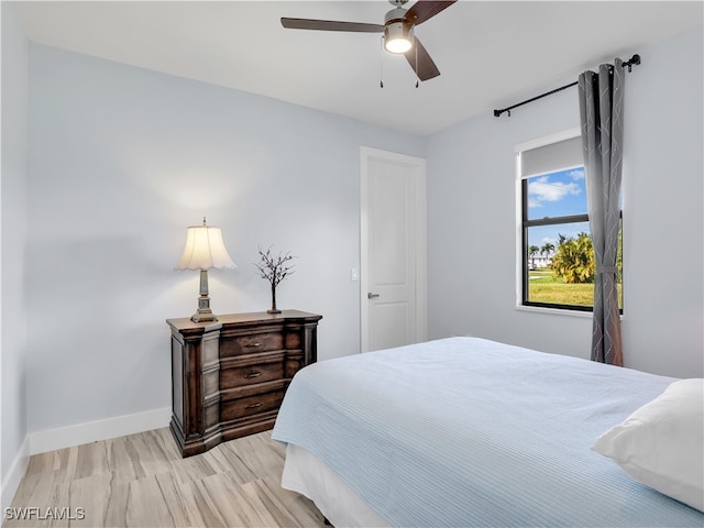 bedroom featuring ceiling fan and light wood-type flooring