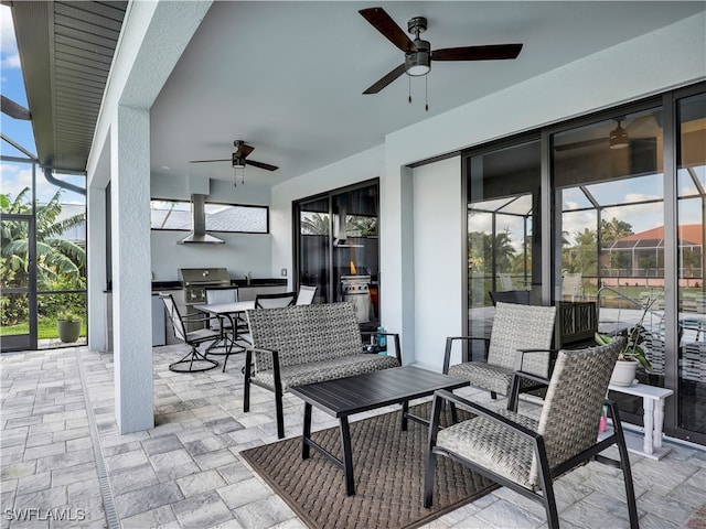 view of patio / terrace with ceiling fan, glass enclosure, and a grill