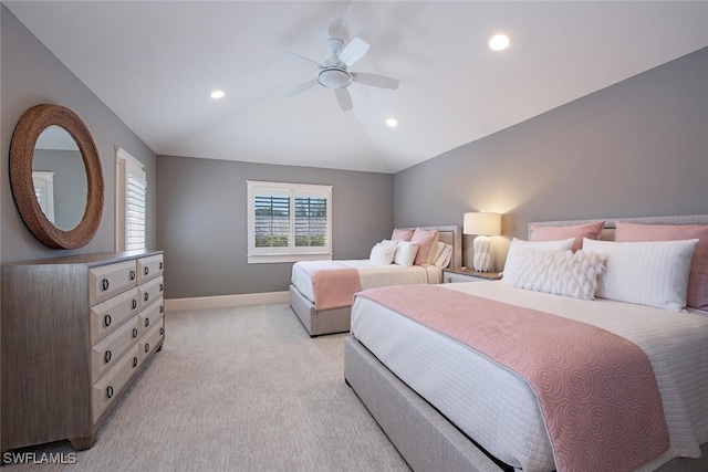 bedroom featuring ceiling fan, light carpet, and lofted ceiling