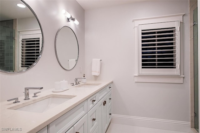 bathroom featuring tile patterned flooring and vanity