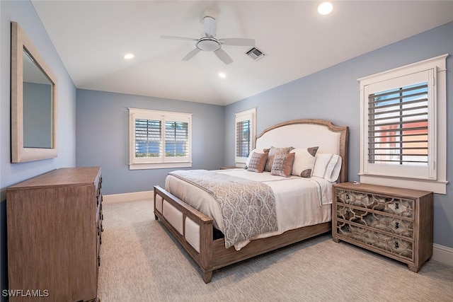 bedroom featuring light colored carpet, ceiling fan, and vaulted ceiling