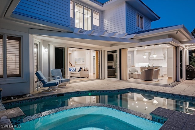 view of swimming pool with a patio area