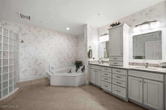 bathroom with tile patterned flooring, vanity, and independent shower and bath