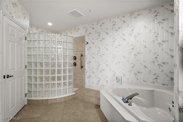 bathroom featuring tile patterned flooring and plus walk in shower