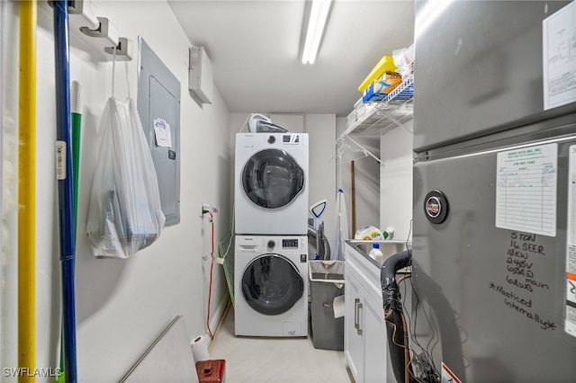 laundry area featuring stacked washer and dryer