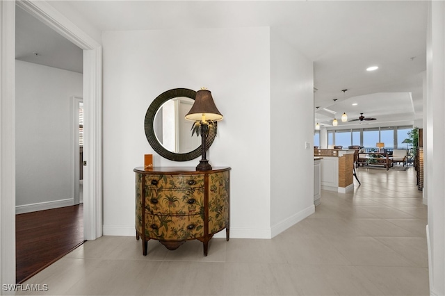 corridor featuring light tile patterned flooring