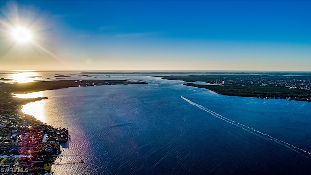 aerial view at dusk with a water view