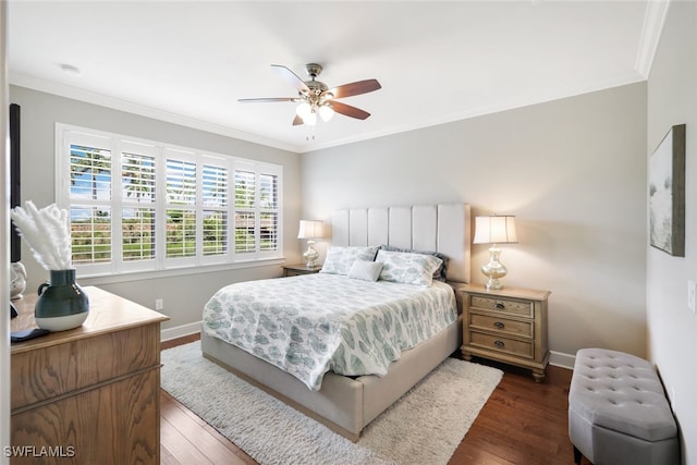 bedroom featuring ceiling fan, dark hardwood / wood-style floors, and crown molding