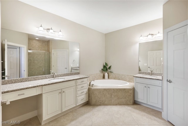 bathroom with tile patterned floors, vanity, and plus walk in shower