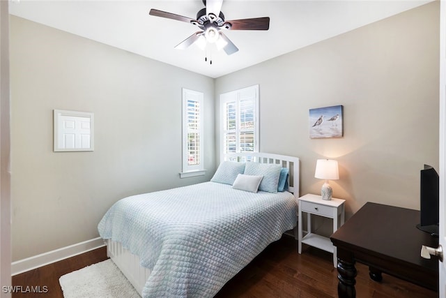 bedroom with ceiling fan and dark hardwood / wood-style floors