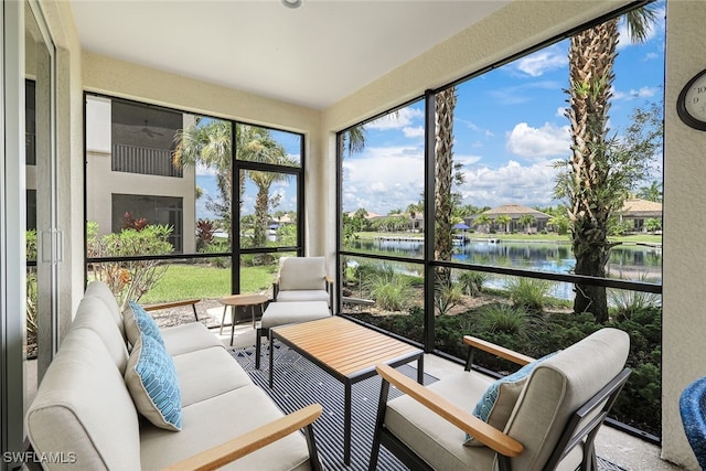 sunroom / solarium with a water view