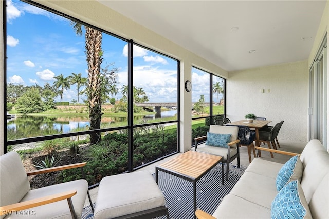 sunroom / solarium with a water view