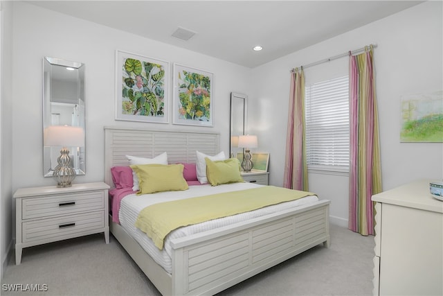 bedroom featuring light colored carpet