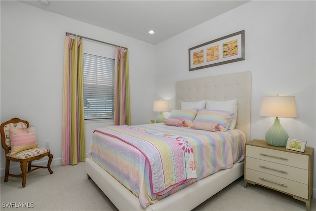 bedroom with light colored carpet