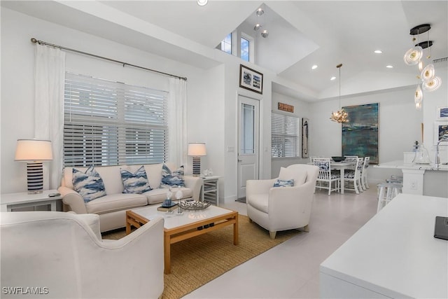 living room with high vaulted ceiling