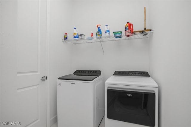 laundry room with independent washer and dryer