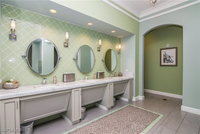 bathroom with tile patterned floors, vanity, and ornamental molding