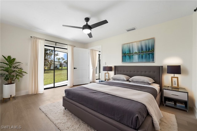 bedroom with ceiling fan, light hardwood / wood-style floors, and access to outside