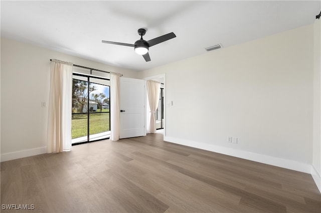 unfurnished room with wood-type flooring and ceiling fan