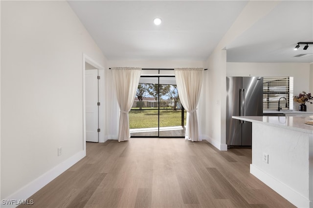 interior space with light hardwood / wood-style flooring