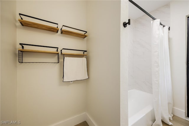 bathroom with shower / bathtub combination with curtain